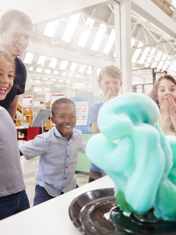 School kids watching an experiment at a science centre